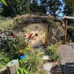 A hobbit house draws much attention and is located near the main house.