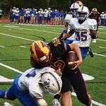 Quarterback Brooks Arnim scrambles for a first down when the pocket collapsed.
Quarterback Brooks Arnim scrambles for a first down after the pocket collapsed.