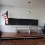 The facility is now used as a community hall but still features some things that were used when it was a school, such as the piano on the right.
