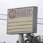 Elisha Meyer/Port Orchard Independent
The old PJs Market Sign is still standing during the demolition process.