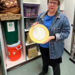 Jane Landry, head librarian for Sustainable Bainbridge Zero Waste Flatware Lending Library, shows off a plate from the collection of items available to community members. Nancy Treder/Kitsap News Group Photos