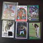 Some cards that may leave the collection soon include a rookie Khalil Mack football card with a patch and a golfer John Daly rookie card.