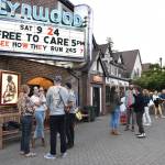 Moviegoers chat outside the Lynwood Theatre after the premiere of documentary, "Free to Care," produced by filmmakers Zach Ignasci and Chris Temple.