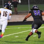 Bainbridge QB Jack Grant avoids the pressure in order to throw the ball downfield.
