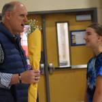 Each volleyball player had the opportunity to hand a bouquet of flowers to their sponsor before or after the game.