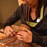 Suquamish tribal member Kippie Joe makes a potlatch hat from cedar bark. Nancy Treder/Kitsap News Group Photos