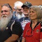 Veterans stand together with their new lapel pins. Elisha Meyer/Kitsap News Group Photos