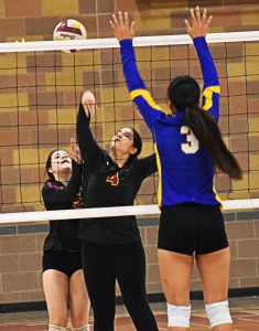 Lagituaiva Hale attempts to block Malak Salems kill attempt. Nicholas Zeller-Singh/Kitsap News Group Photos