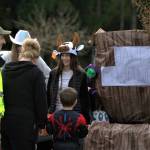 Kids line up to get candy at a trunk or treat at the Life Care Center in Port Orchard.