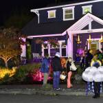 Kids line up for treats at a home in the popular North Town Woods neighborhood. Nancy Treder/Kitsap News Group Photos