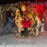 Maeve and Brent Haley pose with a demogorgon, 8-year-old Wylder Modine, in front of their 'Stranger Things' themed decorated house on Halloween. Hasalyn Modine Courtesy Photo