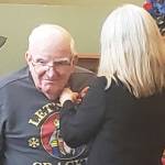 A veteran who lives at Brookdale Montclair in Poulsbo receives a pin for his years of military service. Tyler Shuey/Kitsap News Group Photos