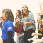 The Kingston bench cheers on its teammates as it came close to winning the second set. Steve Powell/Kitsap News Group Photos