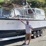 Duran George with his boat 'The Geezer.' Courtesy Photos