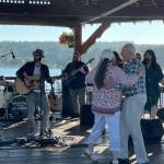 People dance while Backstreet Jellyroll performs at the Summer Night Concert Series in downtown Poulsbo July 12.