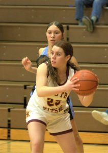 Sophomore Mika Brady holds the ball while searching for a passing lane. Elisha Meyer/Kitsap News Group Photos