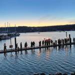 A procession of Vikings waits for the Lucia Bride to arrive at Liberty Bay Dec. 3 in Poulsbo.