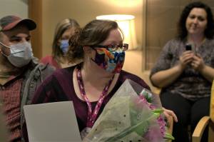 Elisha Meyer/Kitsap News Group
Christina Lanham receives documents with her future appointment times as part of her upcoming smile makeover operation.