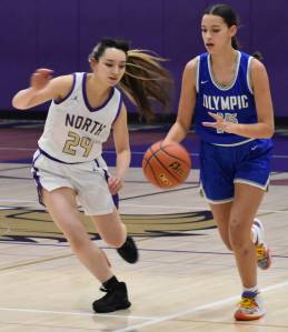 Sophia Brown dribbles past Jade Sunnenberg for the bucket. Nicholas Zeller-Singh/Kitsap News Group Photos