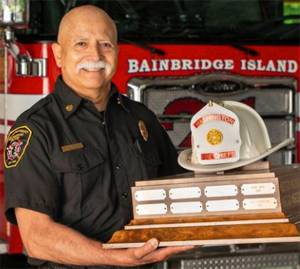 Hank Teran of Bainbridge with his state Fire Chief of the Year award. Courtesy Photo