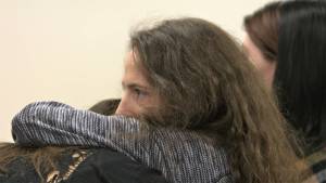 Two of the victims in the case of Stephen Tyler Clayton embrace, one of them in tears, following the acceptance of the plea deal. Elisha Meyer/Kitsap News Group Photos
