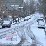 Signs point cars away from the major uphill roads and toward designated snow routes in downtown Port Orchard. Elisha Meyer/Kitsap News Group Photos