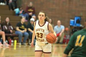 Sophomore Mika Brady takes the ball up the court against Kentridge. Elisha Meyer/Kitsap News Group