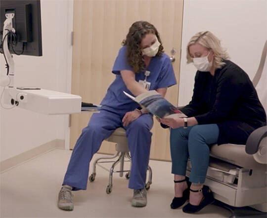 A nurse goes over a chart.