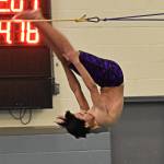 Rydley Strong flips off the diving board and into the pool during the diving event. Nicholas Zeller-Singh/Kitsap News Group