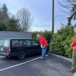 John Demboski and Joe Deets attempt to survey someone sleeping in a vehicle with expired license plate tags.