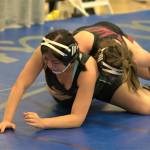 Senior Monica Kaiser of SK works quickly toward a pin of her opponent.