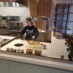 Emily Langford, daughter of owners Brad and Jennifer, prepares a pizza at the newly opened Oath Pizza in Poulsbo. Tyler Shuey/Kitsap News Group Photos