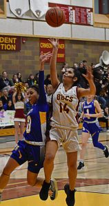 Tatiana Fontes-Lawrence makes a tough basket underneath the hoop to end a dry spell for Kingston. Nicholas Zeller-Singh/Kitsap News Group Photos