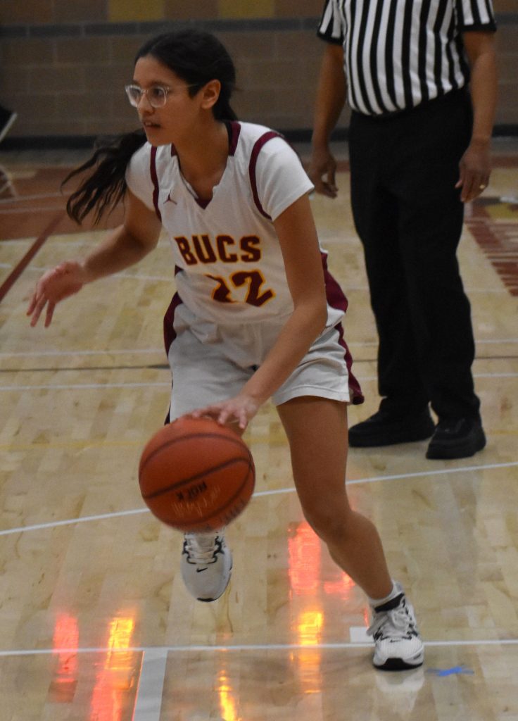 Tayana Caldera drives to the basket for a layup.