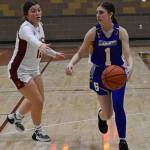 McKaela Robison dribbles around Jayla Moon for the shot.