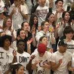 A white out student section cheers on the Wolves.