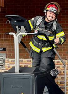 Courtesy Photo
Lt. Kris Osera practices on the stairclimber at Safeway on Super Bowl Sunday.