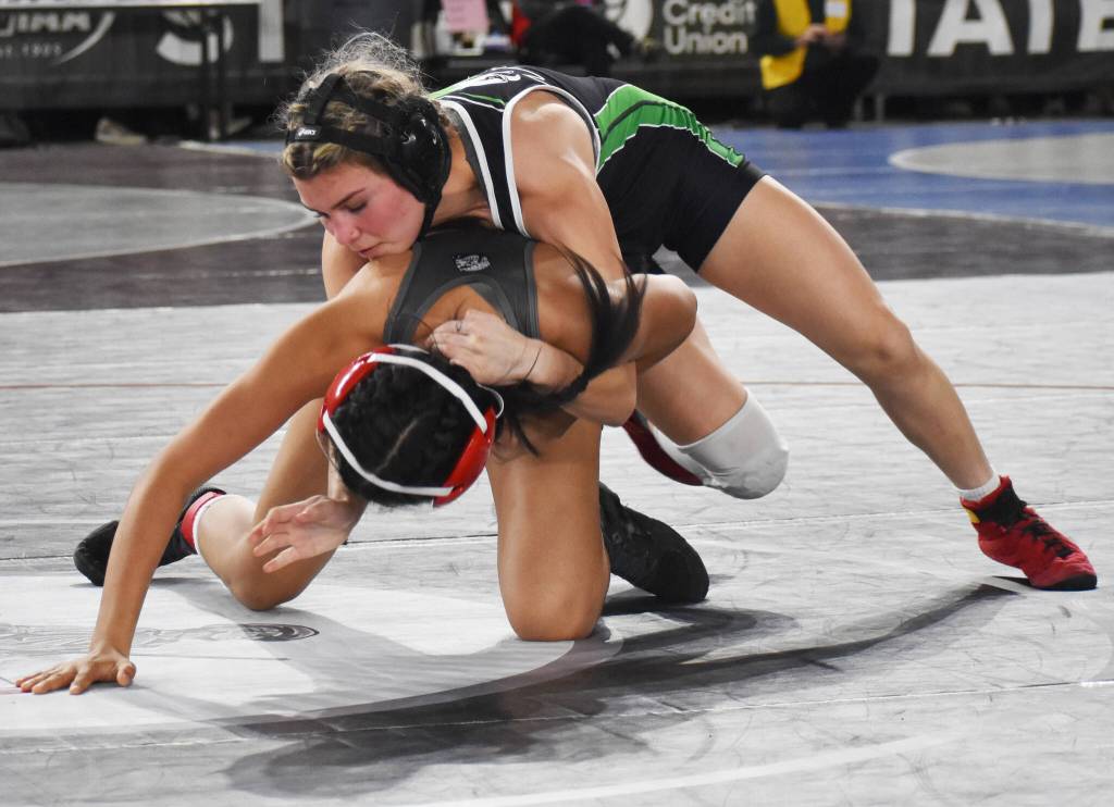 Mya Young turns her opponent before beating her.