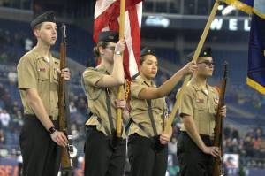 Allison Drury, Nicole Clay, Zachary Morris and Wyatt Jean with the South Kitsap NJROTC present the colors before the inaugural Seattle Sea Dragons game Feb. 23. Elisha Meyer/Kitsap News Group