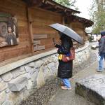 A museum curator examines the memorial.