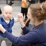 Elisha Meyer/Kitsap News Group Photos
A mom plays with her child, who is holding a bell instrument, during a morning Baby Band activity.