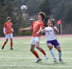 Central Kitsaps Landon Christian and North Kitsaps Mason Chmielewski battle for the ball in the air. Nicholas Zeller-Singh/Kitsap News Group Photos