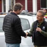Mayor Rob Putaansuu shakes the hand of Dean Nail after awarding him a Key to the City.
