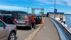 Riders wait for the Southworth ferry. File Photo