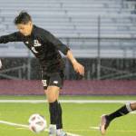 Rain persists as South Kitsap junior Gabriel Fernandez works to keep the ball moving through Sumners defense. Elisha Meyer/Kitsap News Group Photos