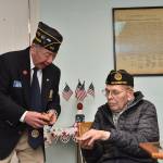 Post commander Gary Sakuma presents Young with a 70-year membership pin. Nancy Treder/Kitsap News Group Photos