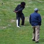 North Kitsaps Dan Weedin gives Kwame Jagodzinske some pointers before hitting his iron.