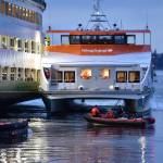 A Kitsap foot ferry parked alongside the Walla Walla to load passengers and take them to Bremerton. Nancy Treder/Kitsap News Group Photos