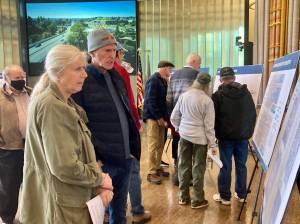 Residents make their way around the chambers to determine their preferred alternative bridge designs. Elisha Meyer/Kitsap News Group