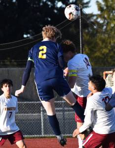 Zach Schramling scores the first goal of the game on a header. Nicholas Zeller-Singh/Kitsap News Group Photos